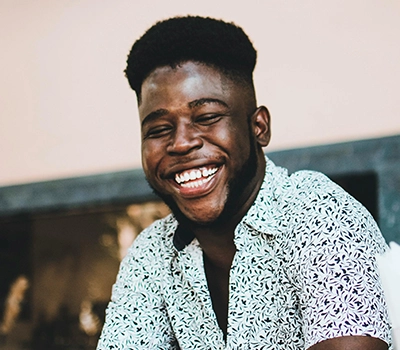A young man, smiling